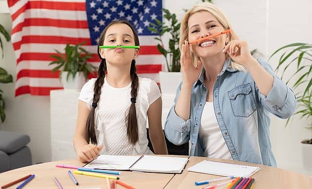 young girl learning english with teacher